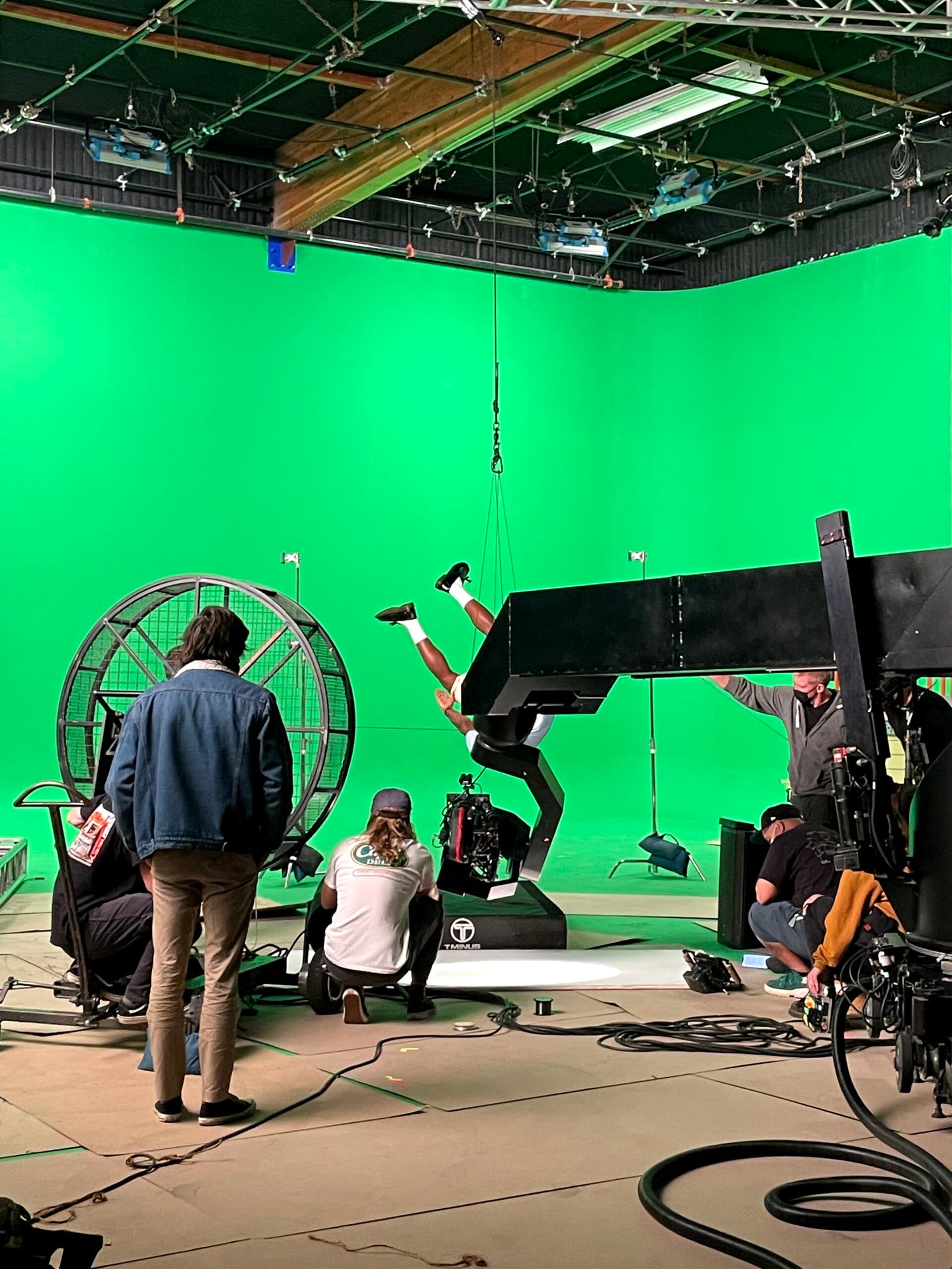On-set VFX supervision — camera crew planning a visual-effects shot on location